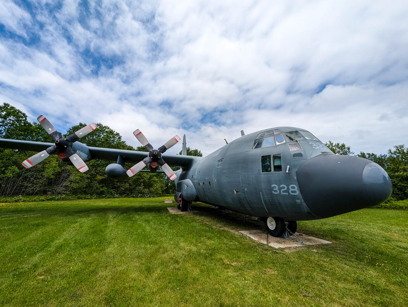 A plane sits outside the Greenwood Military Aviation Musuem
