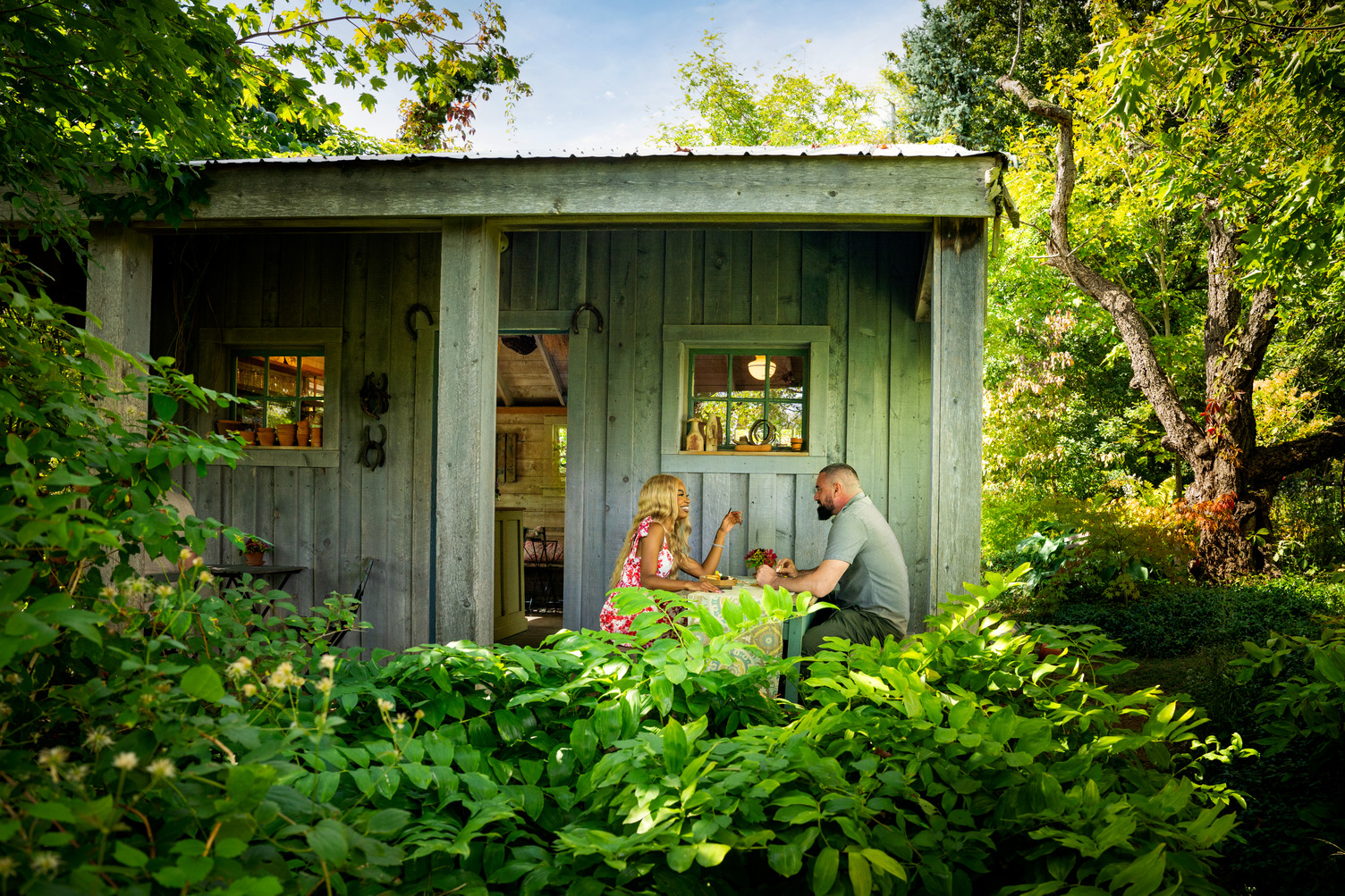 A couple having a snack at the Tangled Garden in Annapolis Valley, Nova Scotia.